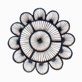 Navy placemat in a flower pattern.